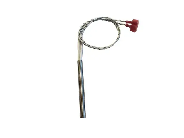 Coiled metal cable with a red handle and long silver shaft on a white background