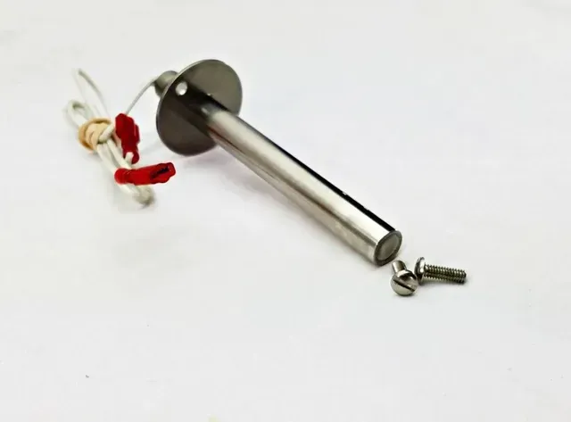 Silver wall-mounted rod with red ribbon and loose screws on a white background