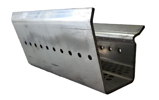 Metal duct or vent cover with perforated holes, shown in silver-gray on a white background