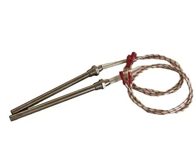 Two braided cords with metal ends, tied together with red string on a white background