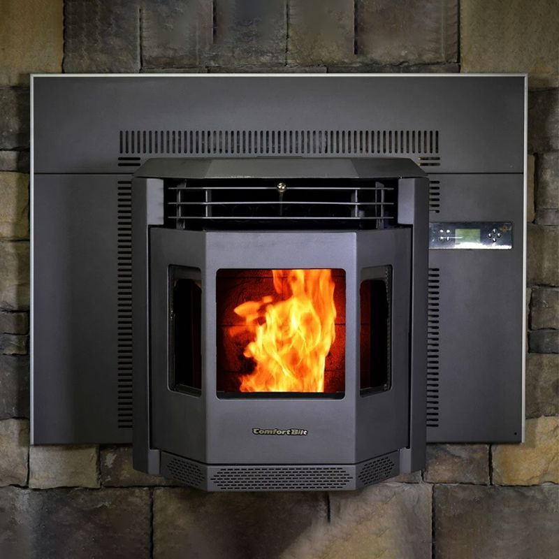Modern black fireplace insert with bright orange flames against a stone wall