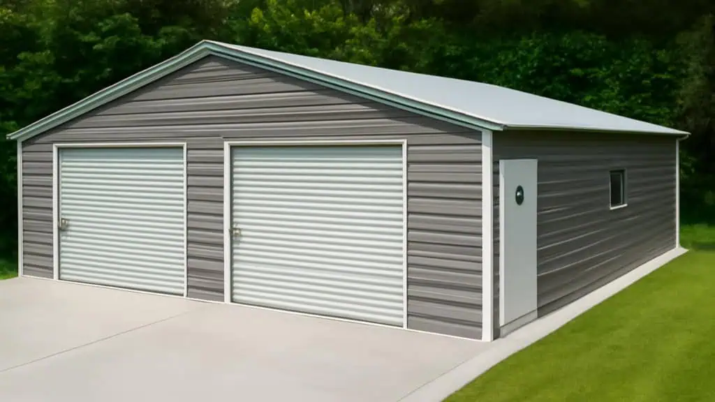 Two-car gray metal garage with white trim, roll-up doors, and a side door, set on concrete with a lawn backdrop.