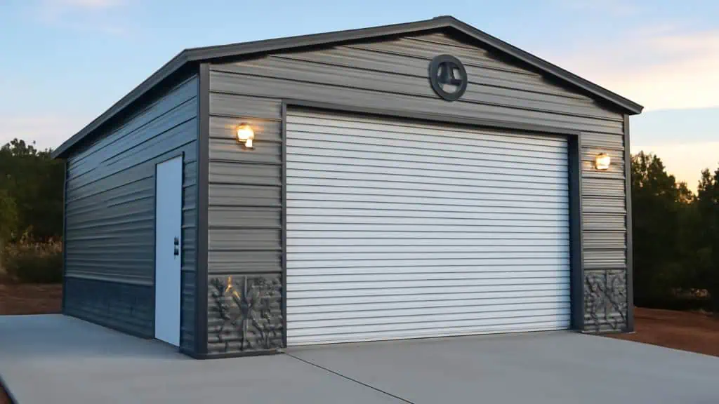 Metal garage with gray siding and white roll-up door, set on concrete.