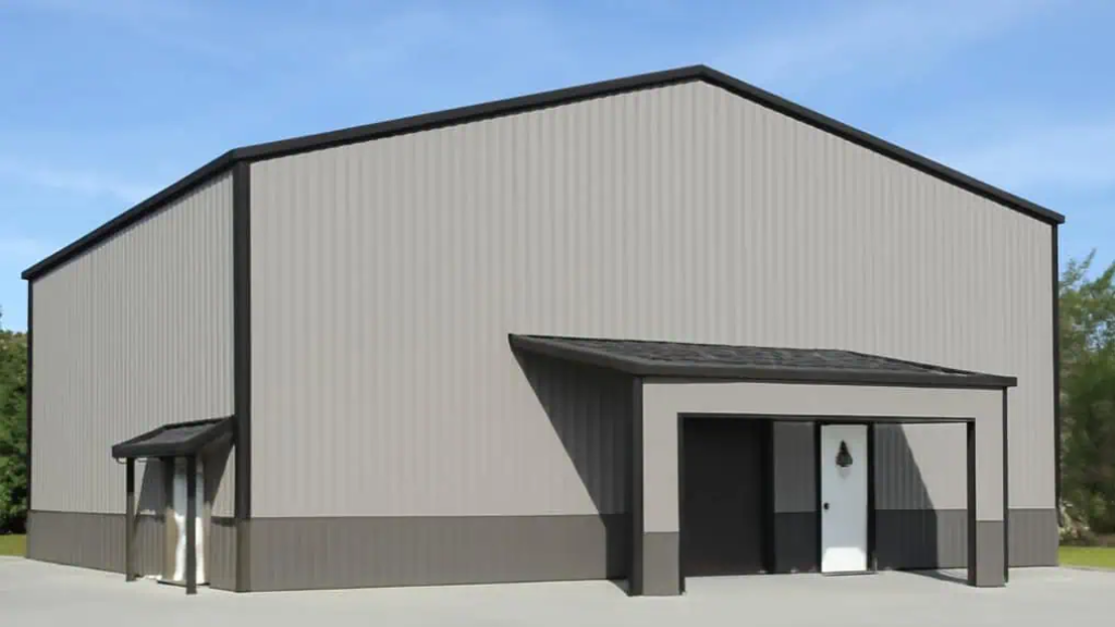 Gray metal industrial building with a small covered entrance and garage doors.