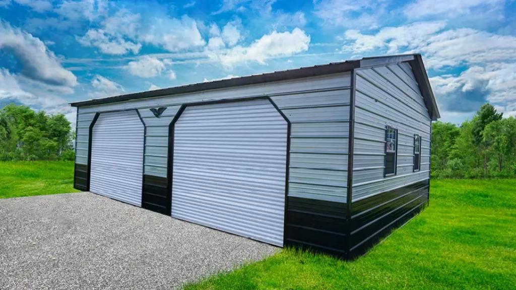 Brown metal garage with two bays and a white door; setting is outdoors on grass.