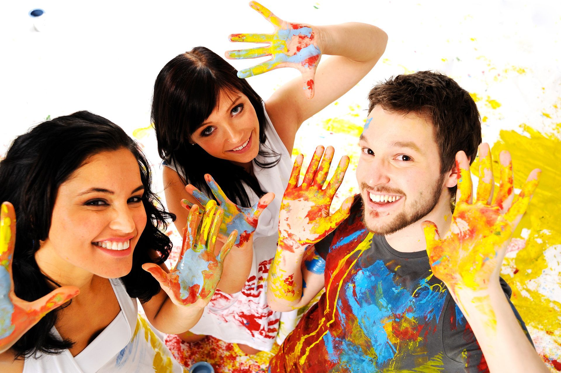 A group of people with their hands painted in different colors.
