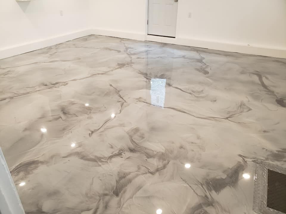 a room with a marble floor and white walls .