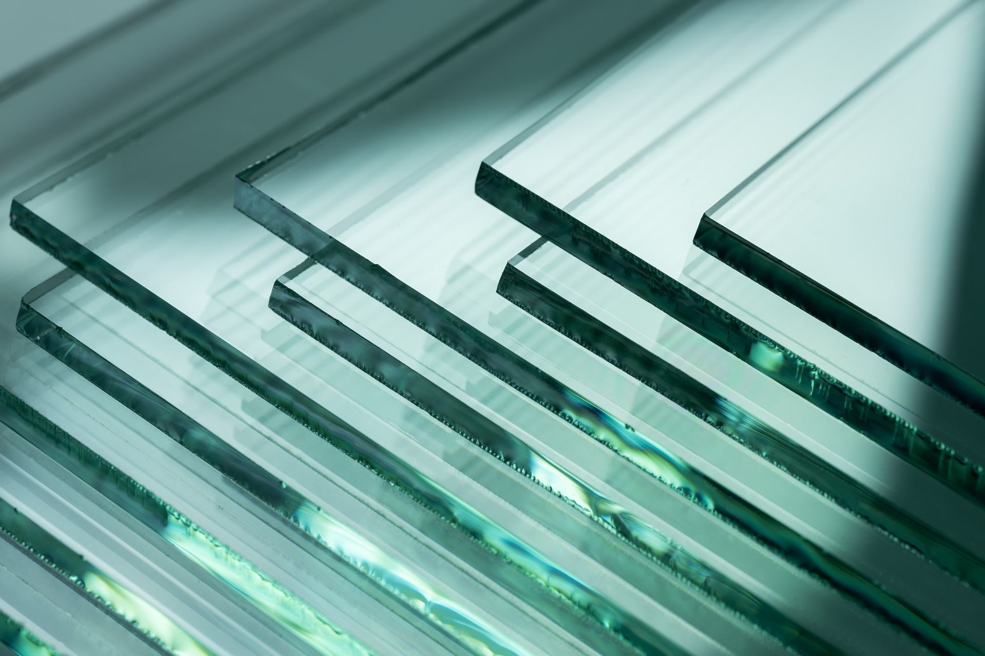 A stack of clear glass sheets sitting on top of each other