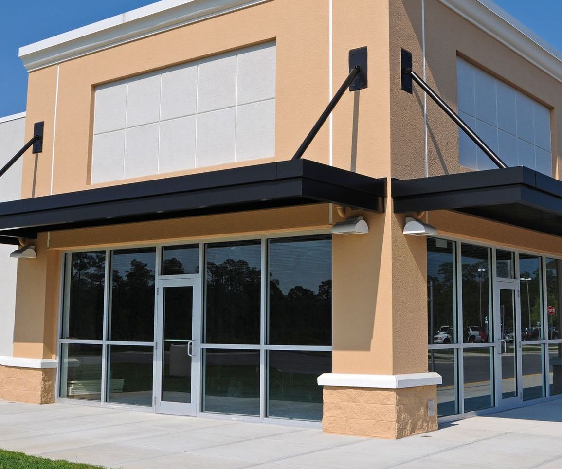 A building with a lot of windows and a black awning