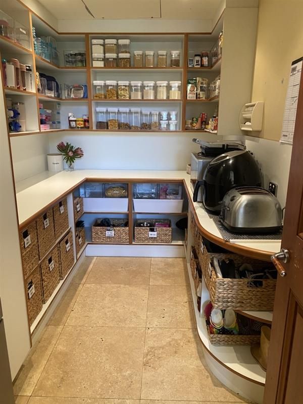 a Closet Filled With Clothes and a Laundry Bag — The Home Assembly In Avoca Beach, NSW