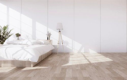 a Bedroom With a Bed, Lamp, and White Walls  — The Home Assembly In Avoca Beach, NSW