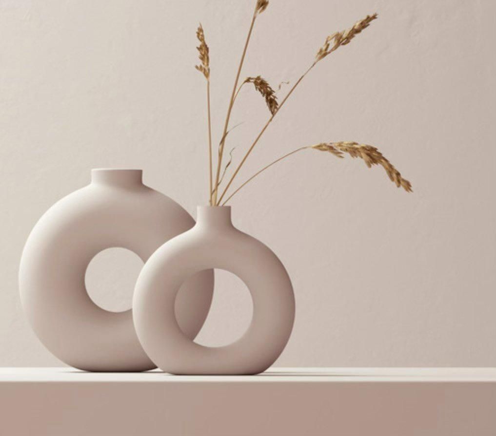 Two Vases with Flowers in Them on A Table — The Home Assembly In Avoca Beach, NSW
