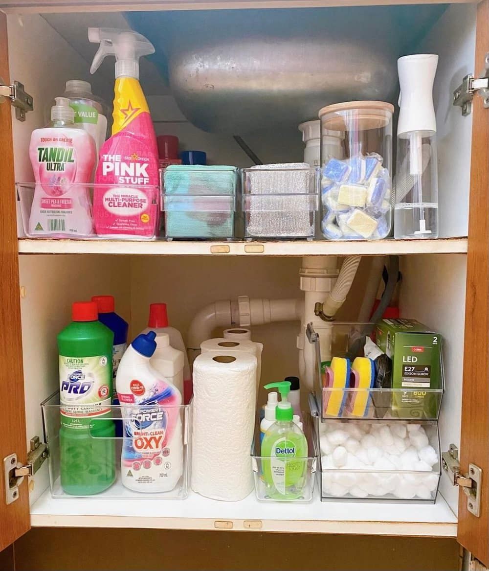 a Bathroom Cabinet Filled With Cleaning Supplies and Toilet Paper — The Home Assembly In Avoca Beach, NSW