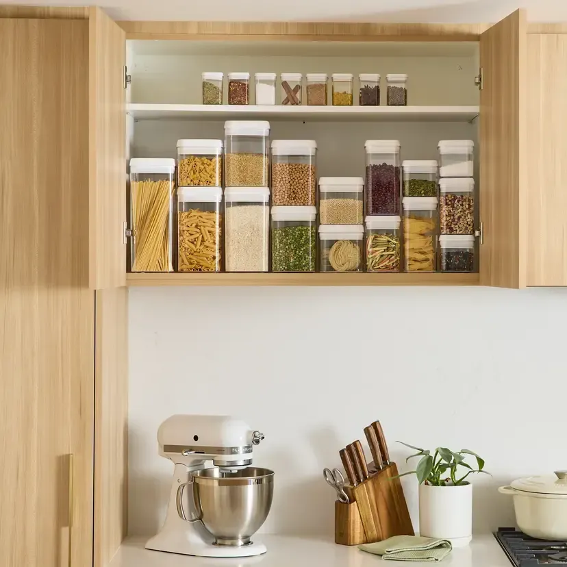 Kitchen Cabinet with Organized Clear Food Storage Containers — The Home Assembly In Avoca Beach, NSW