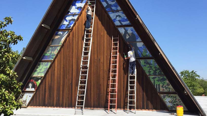 Working on House Gutters — Concord, CA — Cornell Roofing Co., Inc.