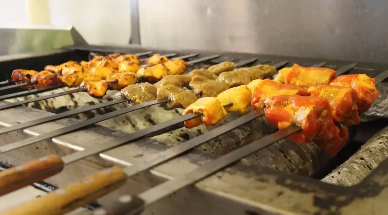 A plate of food with a bowl of dipping sauce