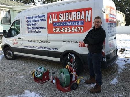 Plumber Near Me — Plumber Standing Beside the Truck in Chicago, IL