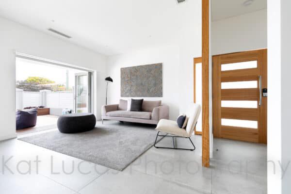 A Living Room With a Couch — Dowdy Constructions in Forster, NSW