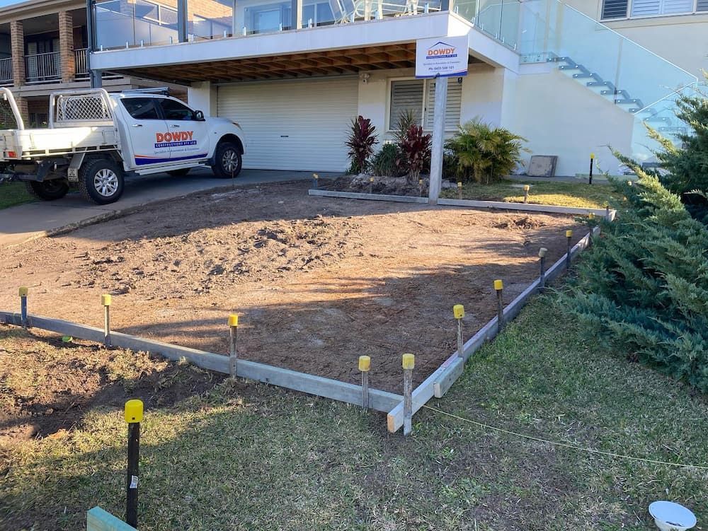 A White Truck is Parked in Front of a House — Dowdy Constructions in Forster, NSW