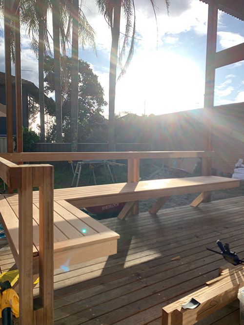 The Sun is Shining Through the Trees on a Wooden Deck — Dowdy Constructions in Forster, NSW
