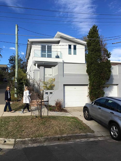Two Women in Front of a Large White House — Dowdy Constructions in Forster, NSW