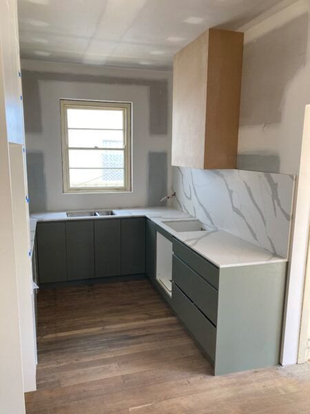 A Kitchen With a Sink, Cabinets, and a Window — Dowdy Constructions in Forster, NSW
