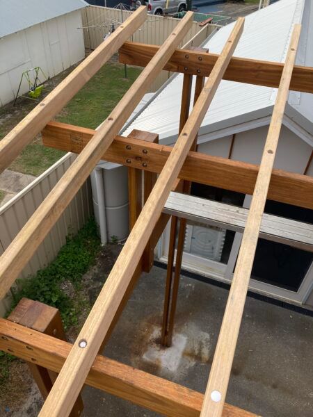 A Wooden Structure is Being Built in Front of a House — Dowdy Constructions in Forster, NSW