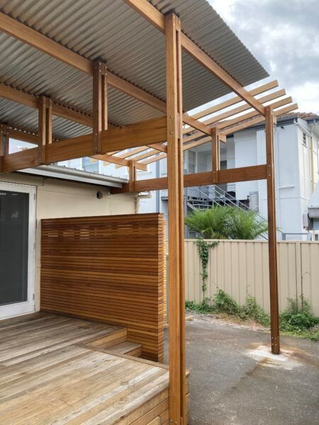 A Wooden Deck With a Pergola Over It — Dowdy Constructions in Forster, NSW