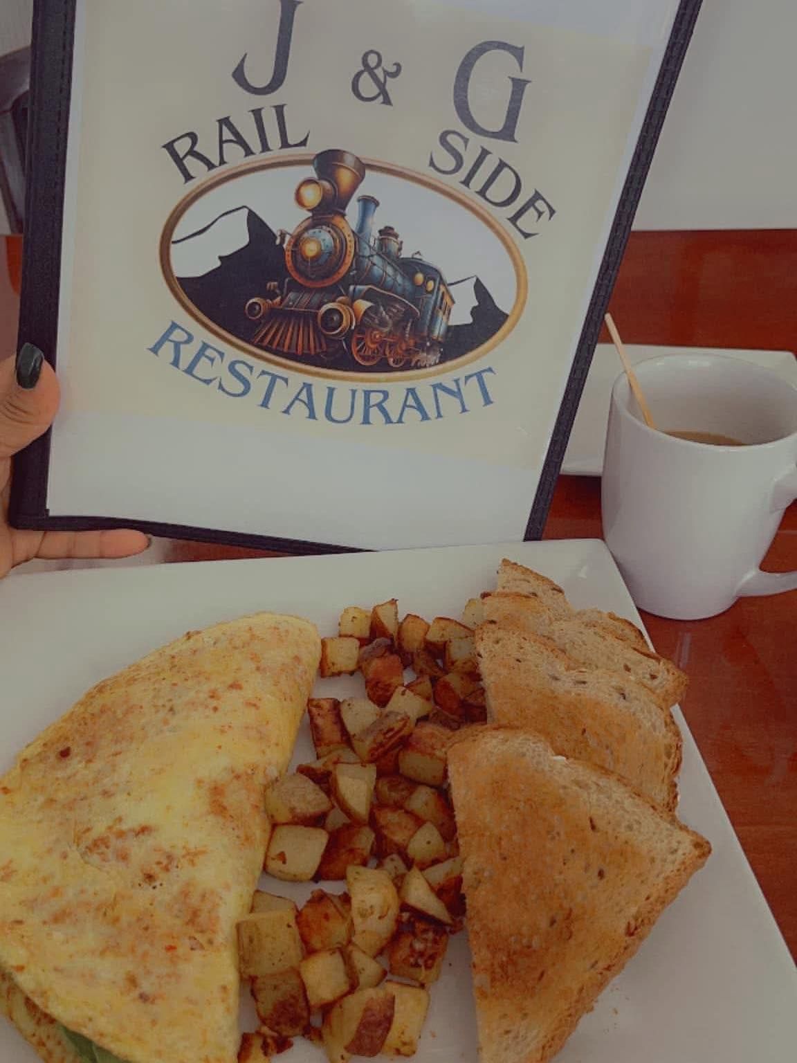 Breakfast at J & G Rail Side Restaurant: omelet, potatoes, toast, coffee cup, menu, person holding menu.