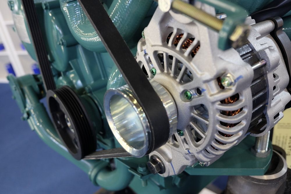 A Close Up of a Boat Engine With a Belt Attached to It — Whitsunday Diesel & Marine In Mackay, QLD