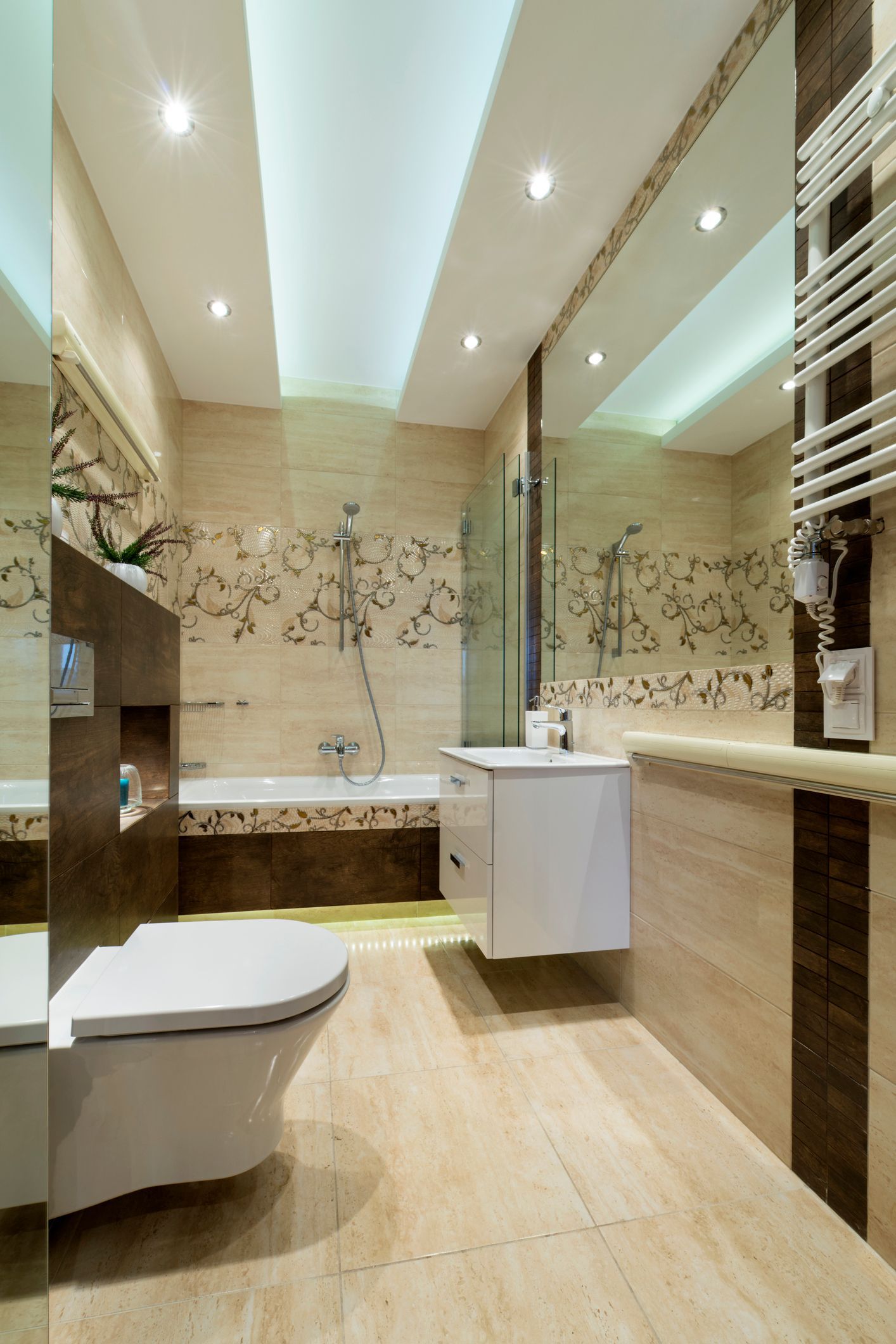 A bathroom with a toilet , sink , and bathtub.