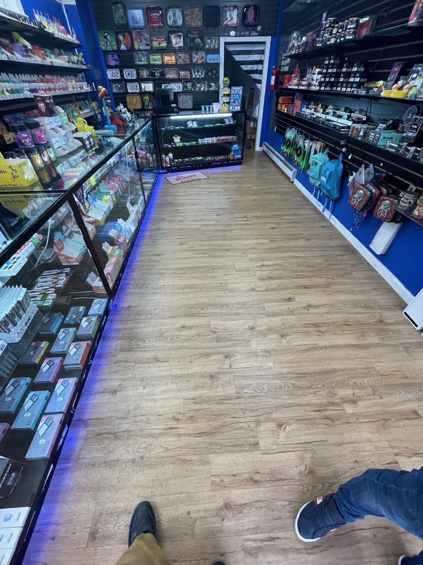 A person is standing in the middle of a store.