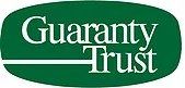 The logo for guaranty trust is green and white.