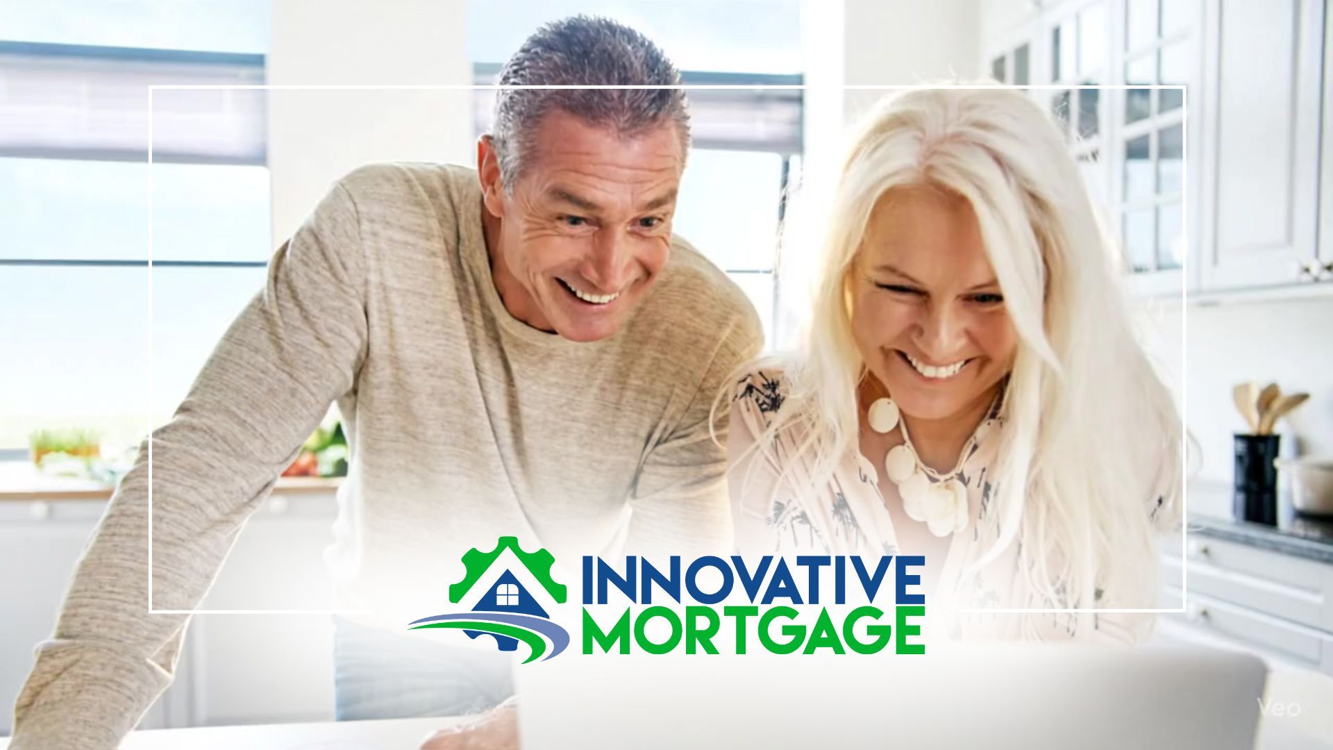 Smiling older couple looking at a laptop screen in a kitchen; Innovative Mortgage logo.