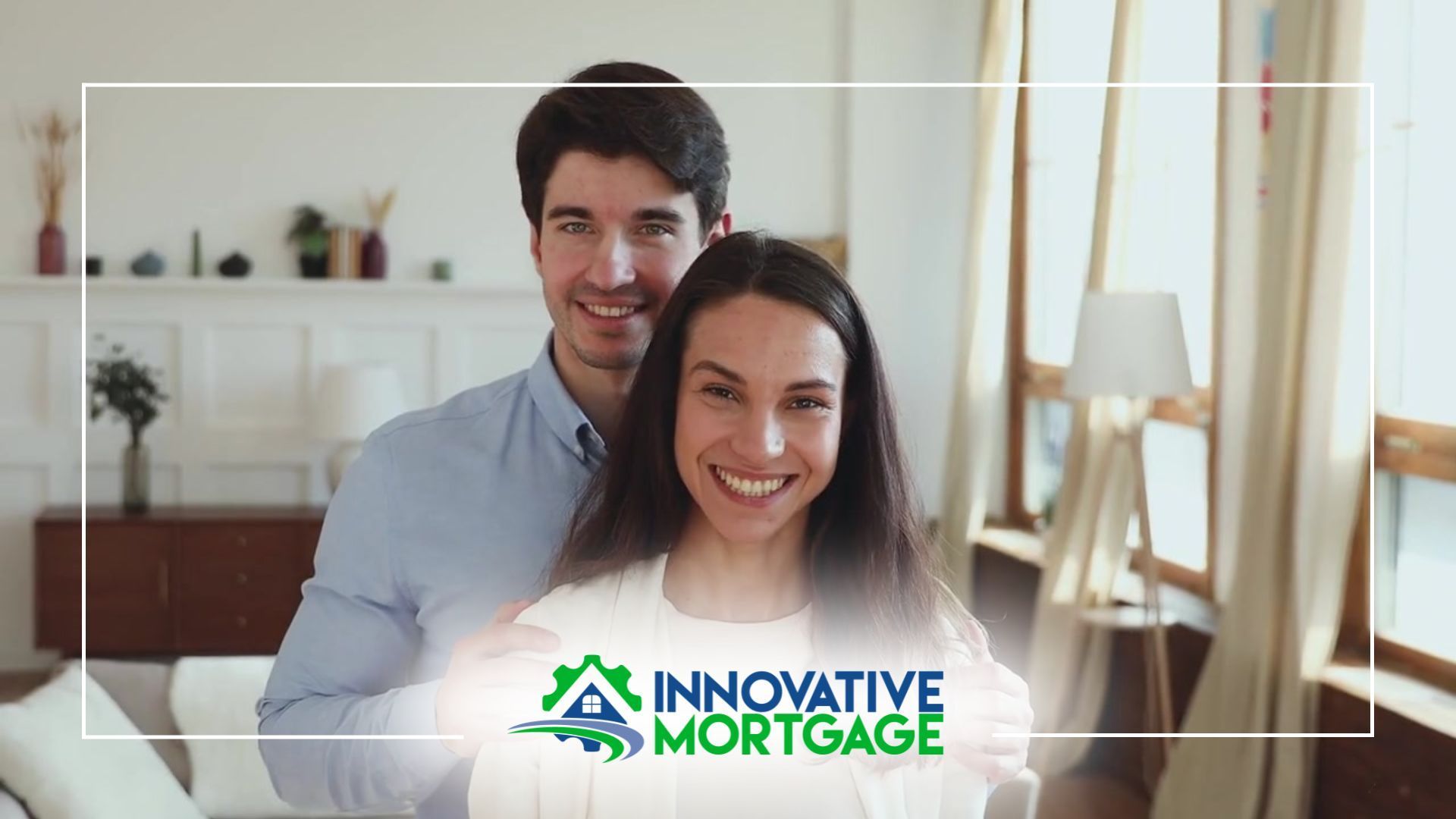 Couple smiling, Innovative Mortgage logo. Man's arms around woman in a bright living room.