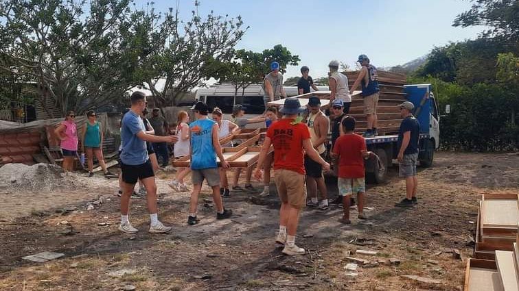 Students building a house.