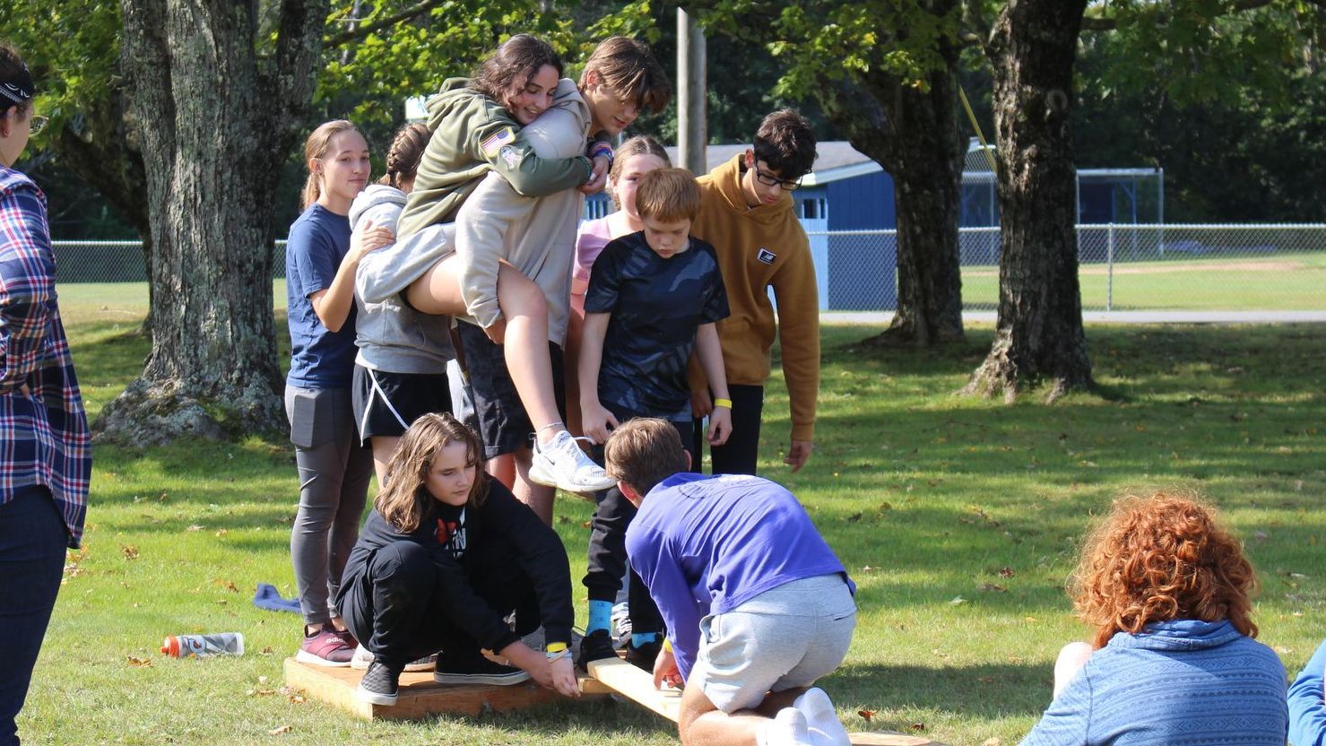 Student working together in a team building exercise.