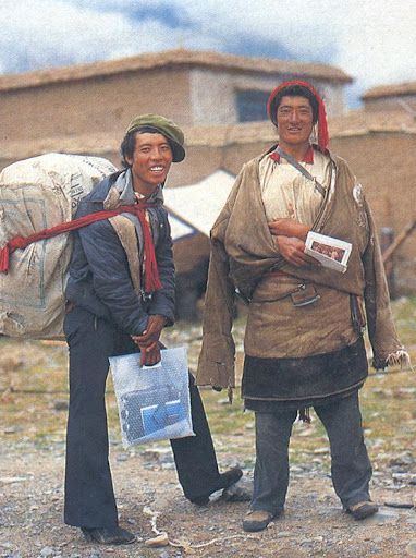 Two happy Tibetans receive gospel booklets and cassettes. [Julian Hawken]