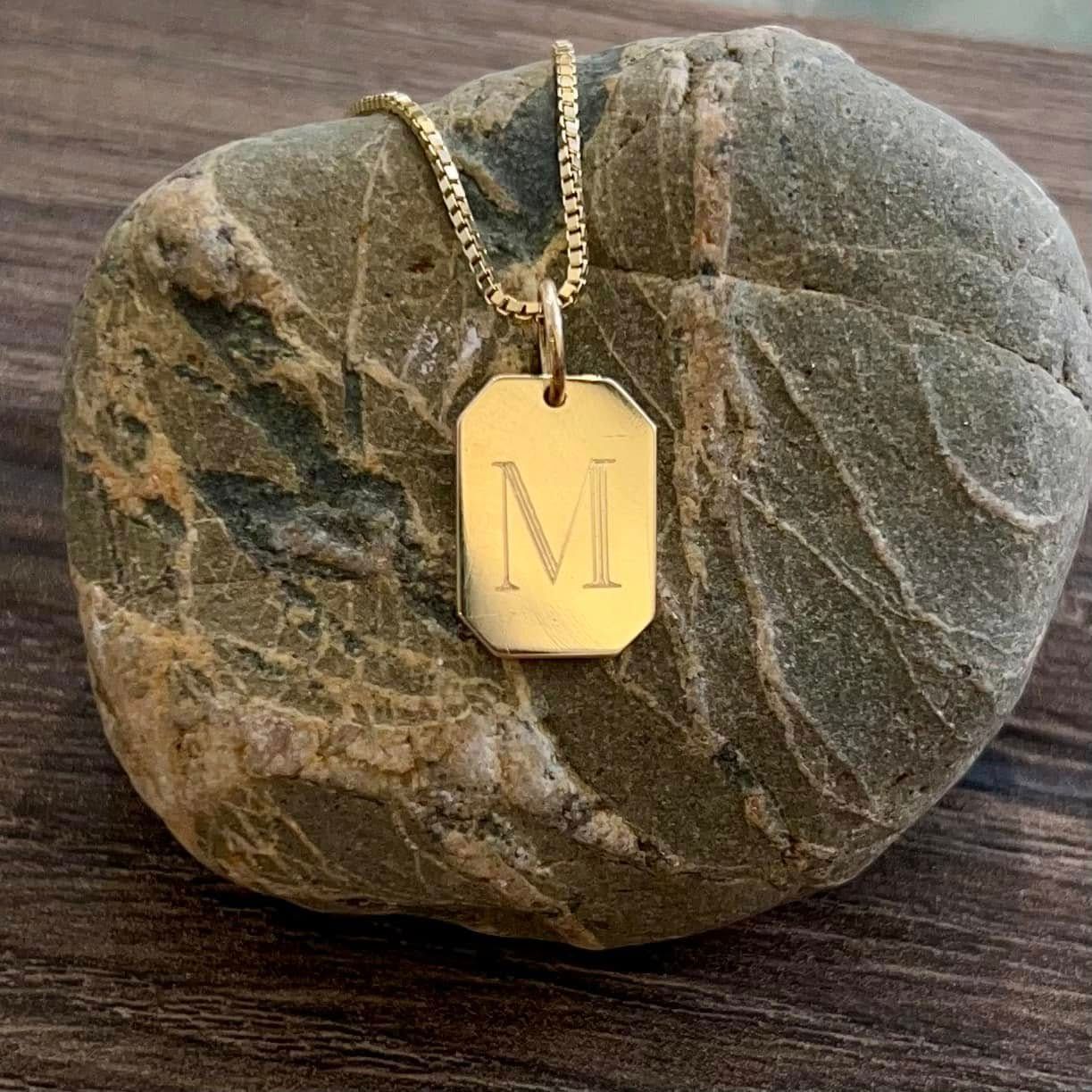 Gold necklace with the letter 