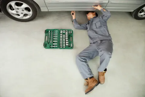 Mechanic Working Under Car | Fiore's Automotive