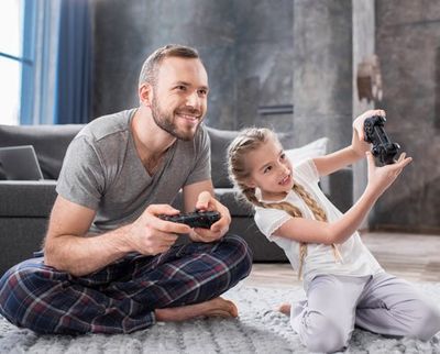 Father and Daughter Playing with Joysticks — Bucks County, PA — Ranniello Inc.