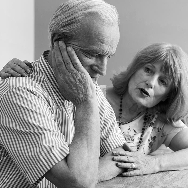 older couple looking sad and unsure