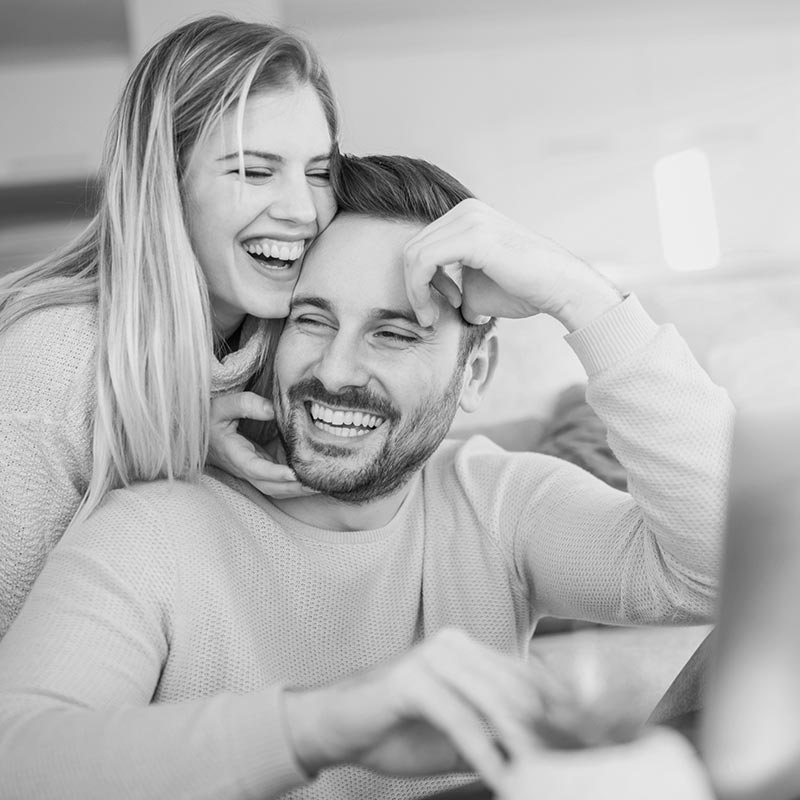 man and woman laughing