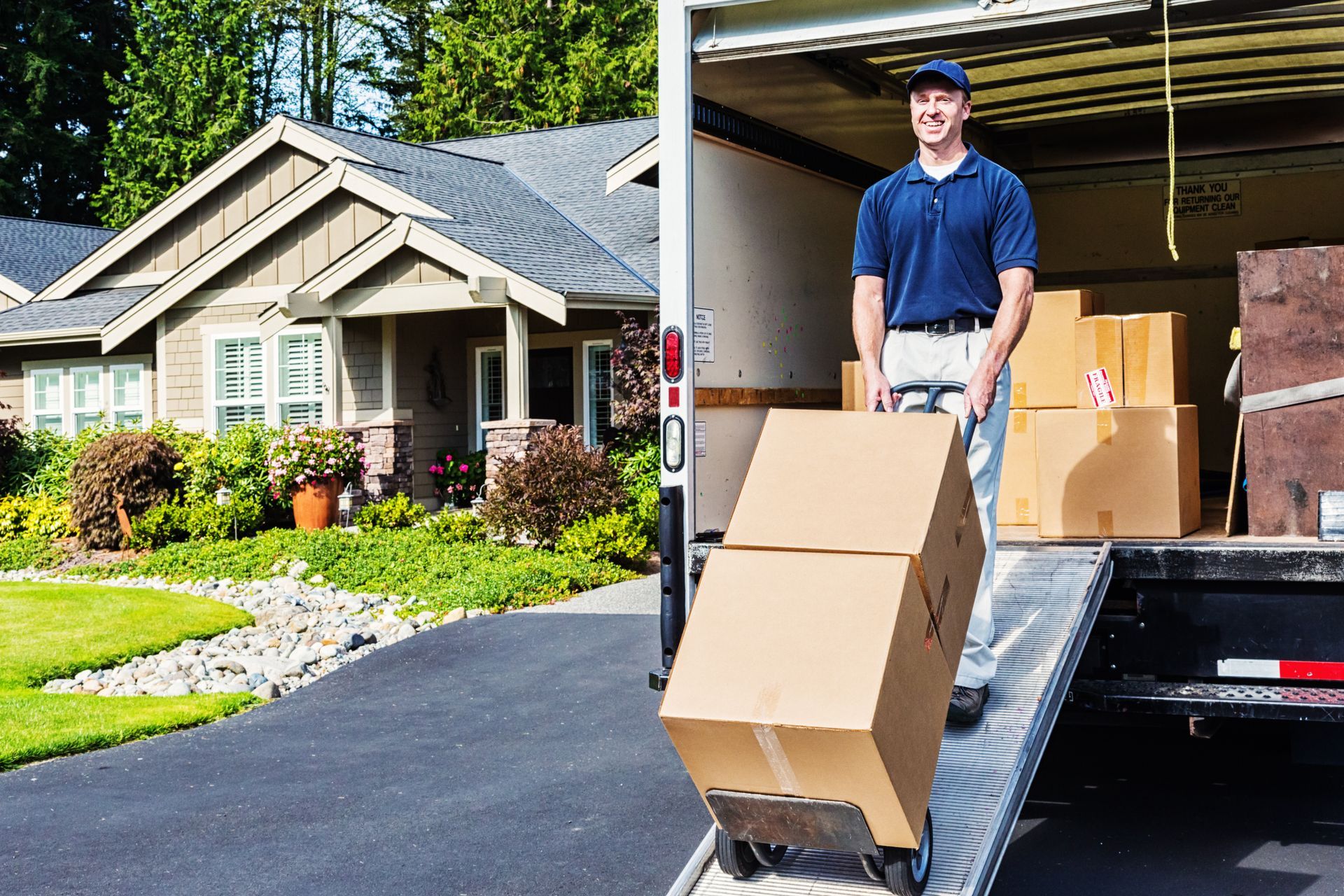 Christofferson Moving & Storage providing residential moving services in Madison, WI, with a expert mover unloading boxes.
