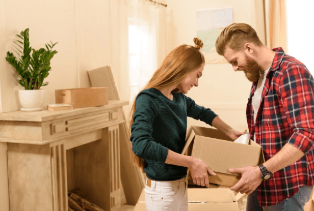 Couple Holding a Box — Court Beloit, WI — Christofferson Moving & Storage