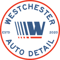 The logo for westchester auto detail is blue and red.