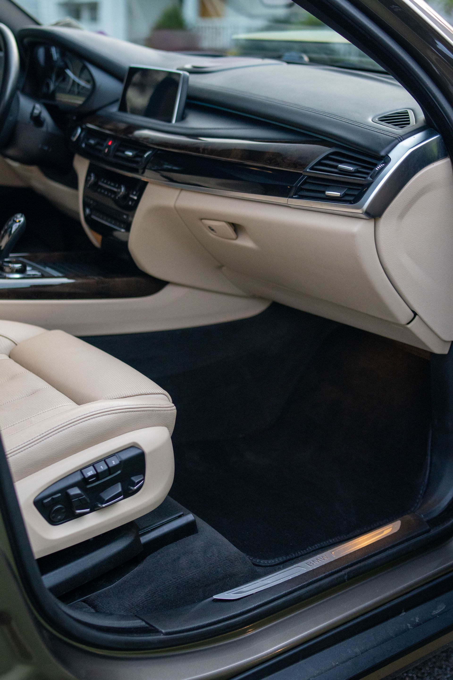 Freshly detailed car interior with leather seats and rubber mats
