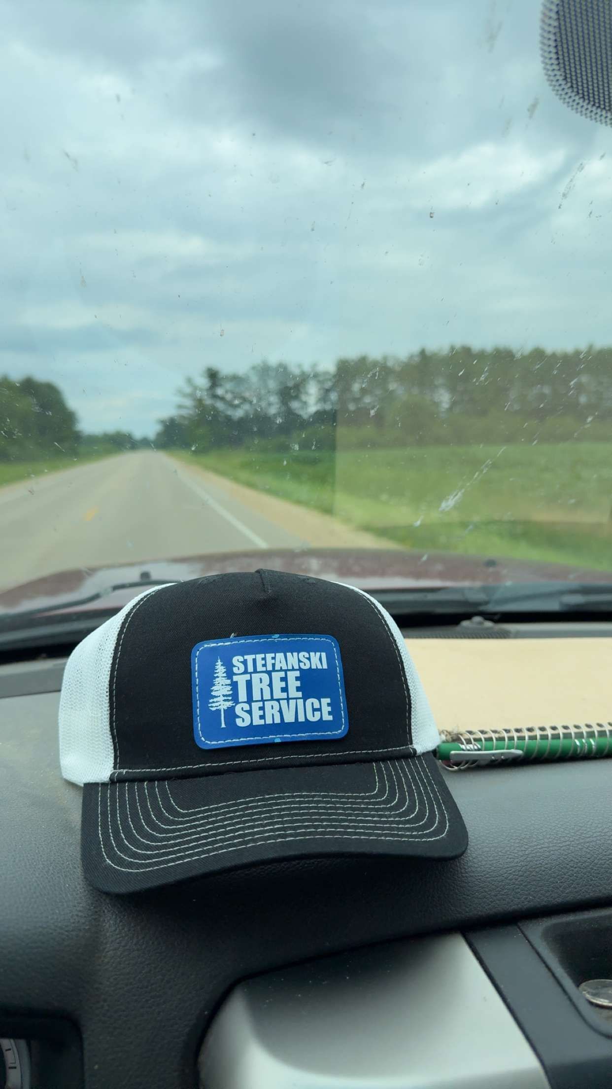 Hat with a blue patch that says 