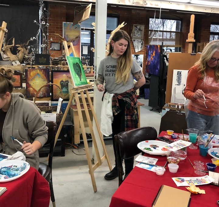participants in group painting night
