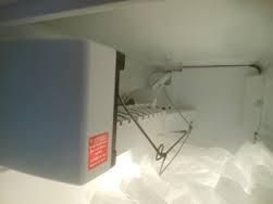 Fort Worth Ice Maker Repair Picture showing a ice maker.being repaired.